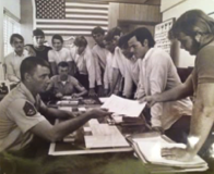Patrick D. Feher — enlistment signing day, American flag on wall